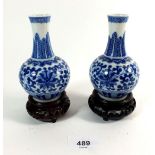A pair of small Chinese blue and white baluster vases on stands, 11cm H