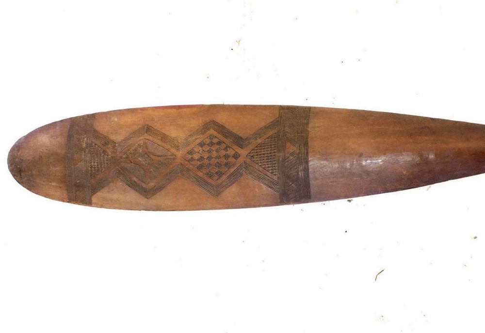 A wooden tribal paddle oar with engraved geometrical design. Possibly Indonesian in origin - Image 2 of 2