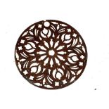 An early 20th century hand carved fretwork gothic style wall decoration in the form of a circular