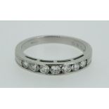 A platinum seven stone diamond half eternity ring, (total 1/2 ct diamonds), size Q