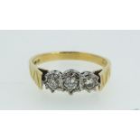 An 18ct gold three stone diamond ring, London 1976, 4g - size Q