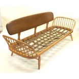 A retro Ercol elm and beech three seater day bed
