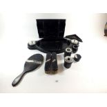 A group of ebony dressing table items, some with silver mounts