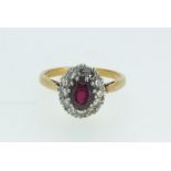 A Victorian 18ct gold and platinum diamond and ruby cluster ring, size I, 3.4g