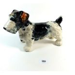 A pottery dog door stop, one eye missing 26cm long