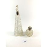 A tall tapered cut glass scent bottle with silver collar and a spherical cut glass scent bottle with