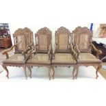 A set of eight Malaysian Colonial (Malaccan) carved hardwood dining chairs in mock Jacobean style