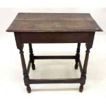 An 18th century mahogany side table on turned supports