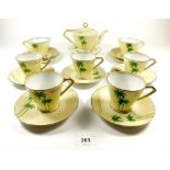A Noritake Art Deco teaset in the Palm Tree pattern, consisting teapot, 7 cups and saucers and 3