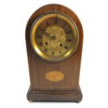 An Edwardian arch top mantel clock with paterae marquetry