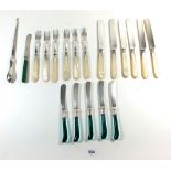 A mother of pearl dessert cutlery set, a set of five green glass handled tea knives and silver