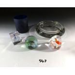 Two Caithness glass paperweights, an Orrefors cube paperweight, a Finnish glass beaker and an