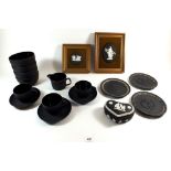 A collection of Wedgwood Black Basalt Jasperware to include three cups and saucers, three bowls,