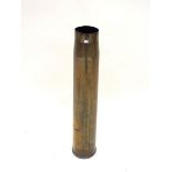 A tall brass shell case, 67.5cm