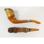 A Meerschaum pipe in the form of a hoof with amber mouthpiece and another carved pipe, cased