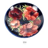 A Moorcroft bowl with blue ground in the Anemone pattern, c1960s. 18.5cm wide.