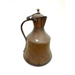 A Middle Eastern copper bell form water jug, 39cm