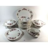 A Royal Albert Lavender Rose dinner service comprising meat plate, six dinner plates, gravy boat,