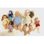 A German early 20th century large bisque headed doll marked B 7, three various vintage dolls and two