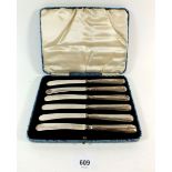 A set of six silver handled tea knives cased