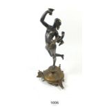 A 19thC bronze candle holder of figural form of a classical lady - 23.5cm