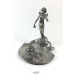 A WMF Art Nouveau pewter figural inkstand of a lady reading a letter. c1910, stamped WMFB to base