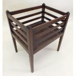 An early 20th century mahogany magazine rack