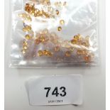 A parcel of calibrated round citrine, total 24.5cts (2.5mm, 3mm, 4mm)