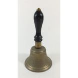 A brass hand bell with wooden handle, 19cm