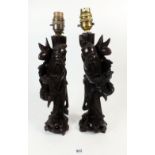 Two carved wood Chinese table lamps in the form of immortals, 30cm