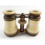 A 19th century pair of French bone clad opera glasses by Yager & Co, cased