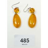 A pair of amber bead and silver earrings