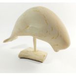 A Inuit carved white stone Beluga Whale by Leah Kalluk, repair to tail, 22cm
