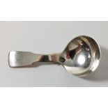 A silver fiddle pattern caddy spoon, Birmingham 1830, by Unite & Hilliard