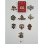 A good selection of cap badges, Borde regiment etc. and a pack of US government 1945 aviator playing