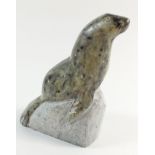 A Greenland Inuit carved stone seal on a rock, 11cm from Baffin Island