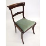 A Regency rosewood bar back chair on sabre supports