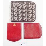 A Christian Dior blue logo fabric wallet and an antique Dunhill red leather slide out purse/