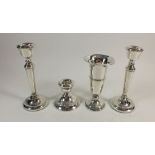 A pair of modern silver candlesticks 15cm, a silver vase and small candlestick