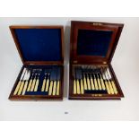 Two sets of Victorian bone handled dessert cutlery in mahogany cases (one fork deficient)