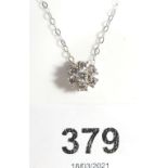 An 18ct white gold diamond cluster pendant on fine 18ct white gold chain