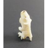 An Inuit carved bone polar bear/fish spirit, 4cm from Qaanaaq