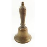 A brass and wood hand bell