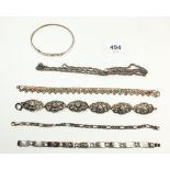 Four silver bracelets, a white metal Indian bracelet and a silver chain