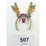 A plique-a-jour enamel and marcasite silver insect brooch