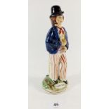 A modern Staffordshire figure of 'Gin and Water', 22cm.