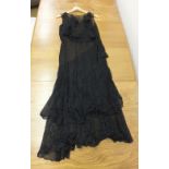 An early 20th century black lace tiered evening dress and an Edwardian muslin dress