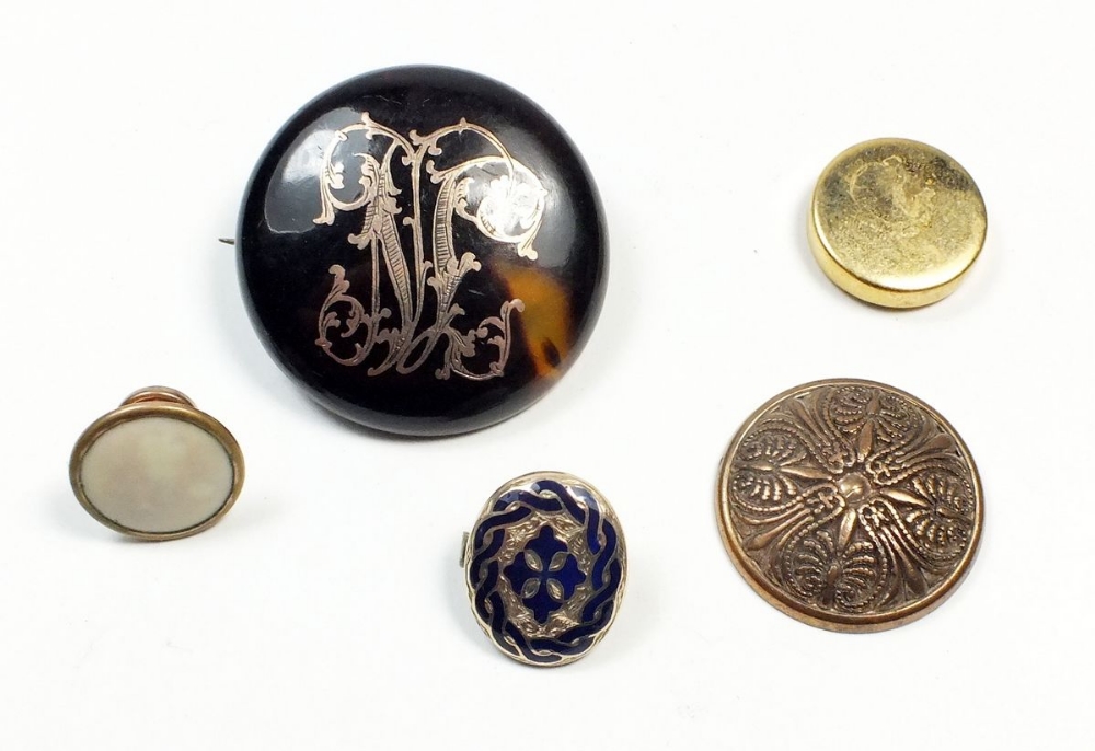 A Victorian tortoiseshell brooch inset with gold monogram and four various studs