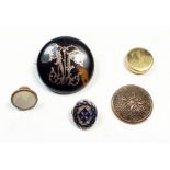 A Victorian tortoiseshell brooch inset with gold monogram and four various studs