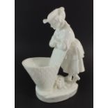 A Minton white glazed posy vase in the form of grape picker resting on her basket, 22cm